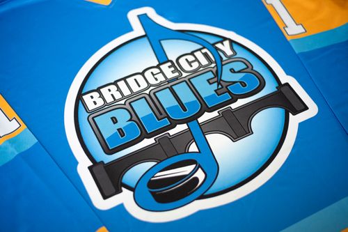 Saskatoon Bridge City Blues blue hockey jersey by Minuteman Press